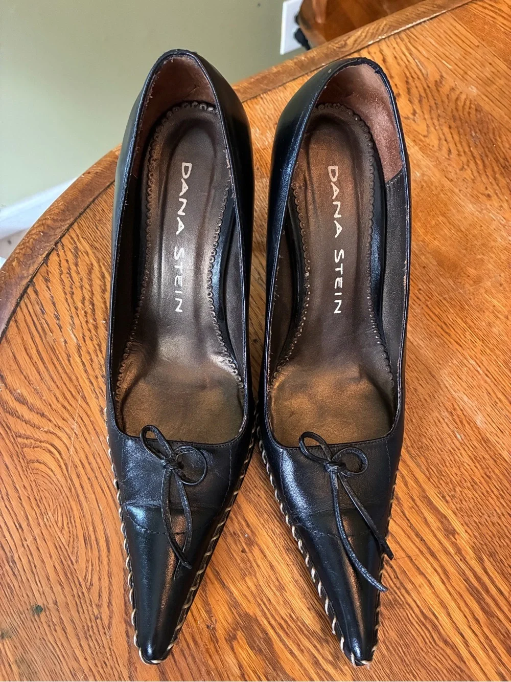Black Pointed Leather Heels with Bow Accent